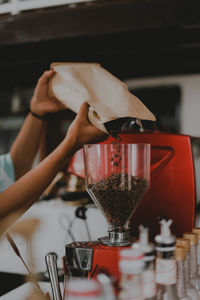 Midsection of woman holding coffee cup