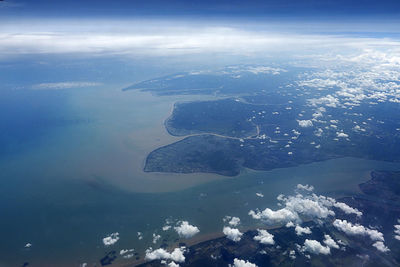 Aerial view of island and sea against sky