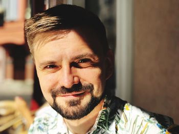 Close-up portrait of man smiling outdoors