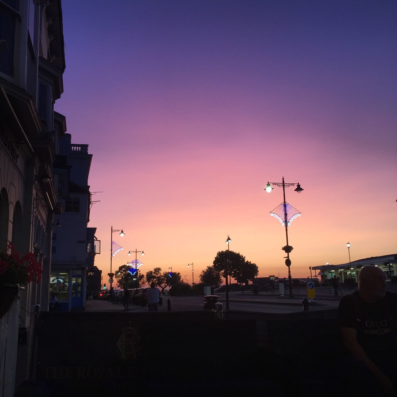 SILHOUETTE CITY STREET AGAINST SKY AT SUNSET