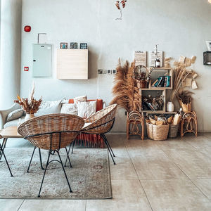 Chairs and tables in cafe against building