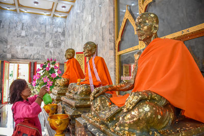 Group of people in temple outside building