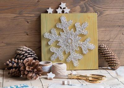 Close-up of pine cones and christmas decorations on table