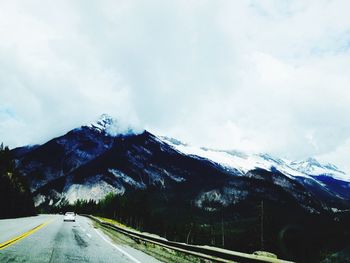 Country road leading towards mountains