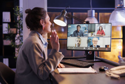 Portrait of woman using digital tablet in office