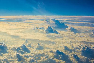 Aerial view of landscape against blue sky