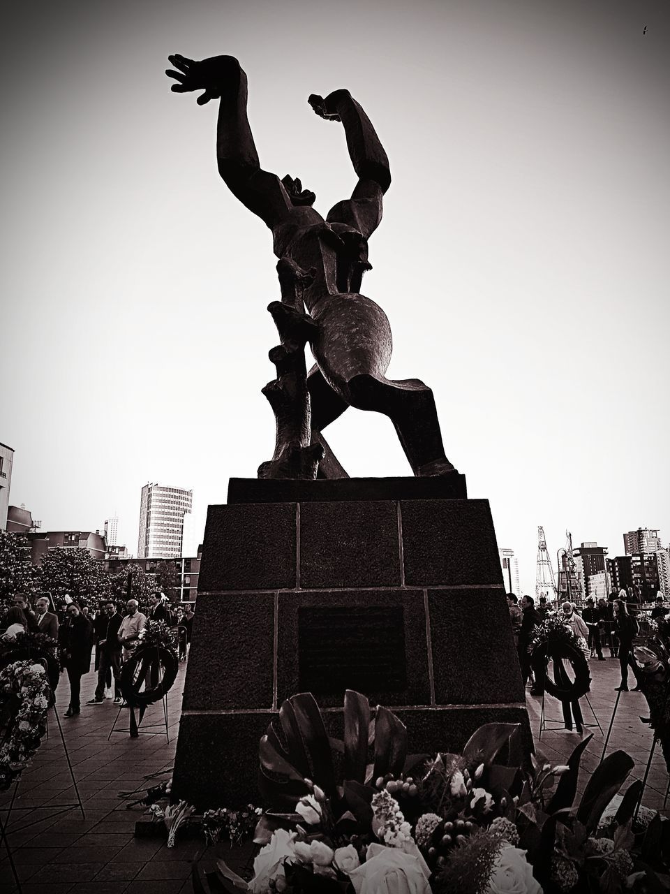 STATUES AGAINST CLEAR SKY