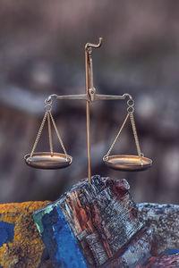 Close-up of rusty chain on wood