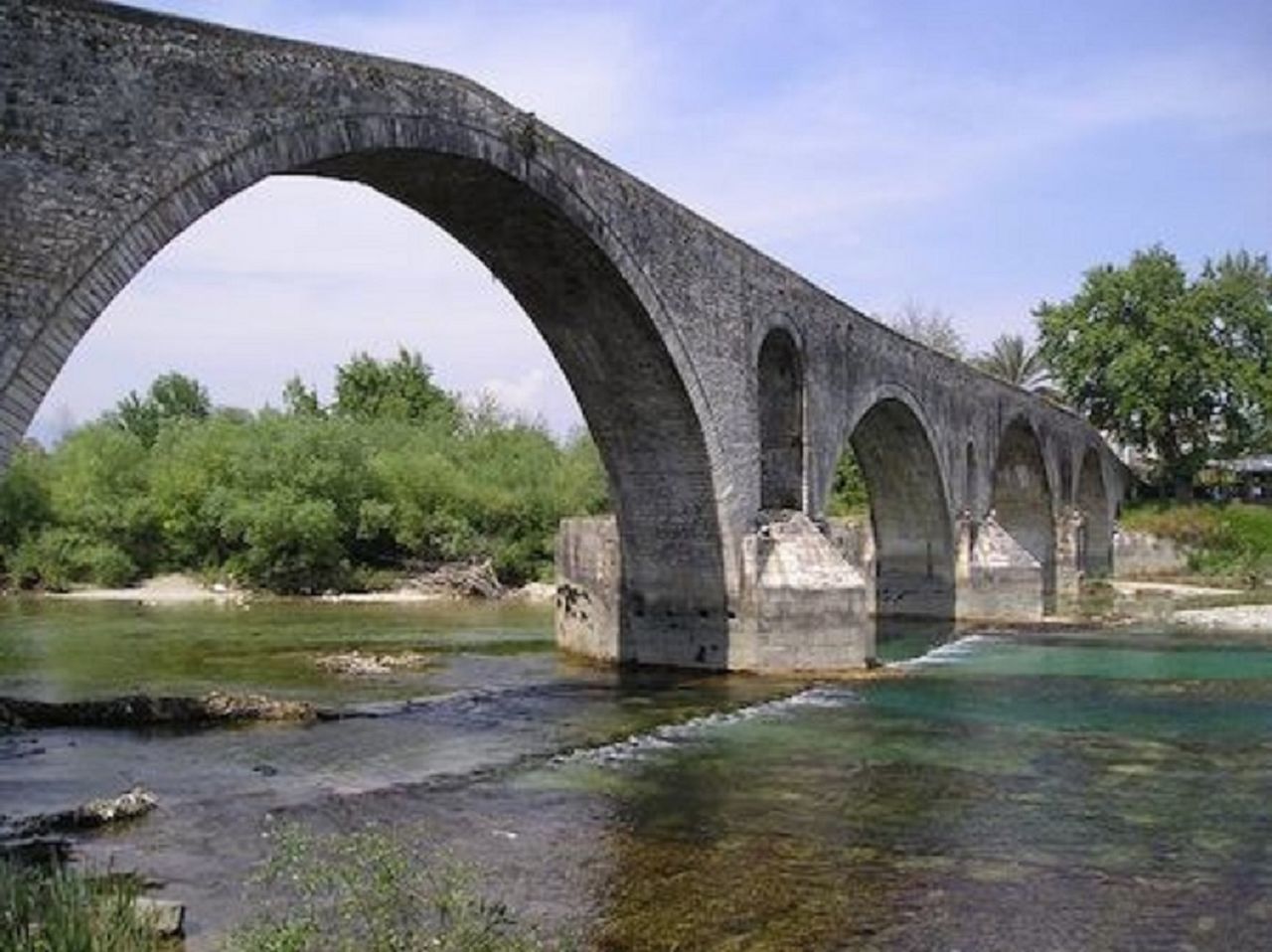 BRIDGE OVER RIVER WITH BRIDGE IN BACKGROUND