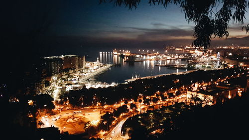 Aerial view of city lit up at night