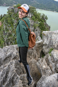 Full length of man standing on rock