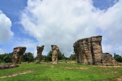 Low angle view of rock formations against sky