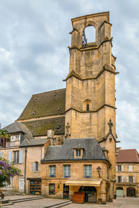 Low angle view of clock tower against sky