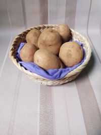 High angle view of fruits in basket on table