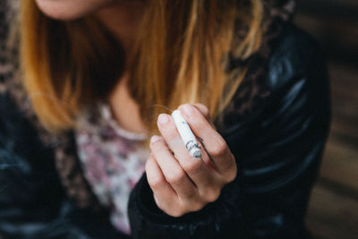 Close-up of hand holding sunglasses