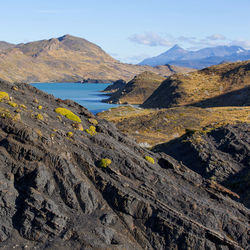 Scenic view of landscape and mountains against sky