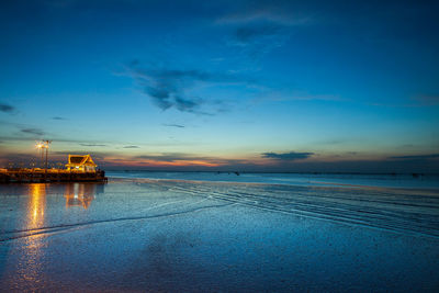 Scenic view of sea against sky at sunset