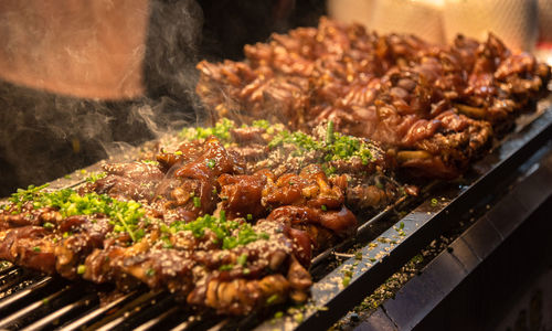 Close-up of meat on barbecue grill