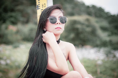 Portrait of young woman wearing sunglasses