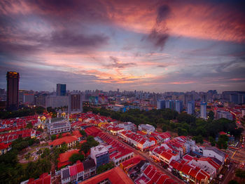 Aerial view of cityscape against sky during sunset