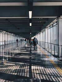 People walking on railroad station platform