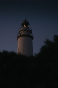 Lighthouse against clear sky at formentor, mallorca, spain.