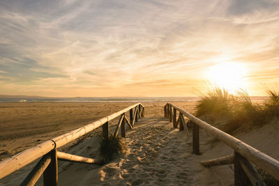 Scenic view of beach against sky during sunset