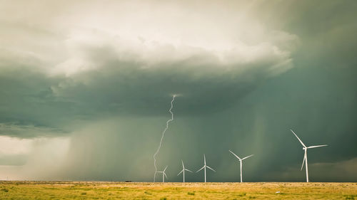 Scenic view of field against sky cloudy, clodus of rain, balck color of clouds, rainy strom