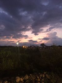 Scenic view of landscape against cloudy sky