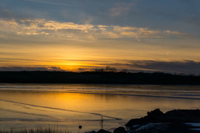 Scenic view of sea at sunset