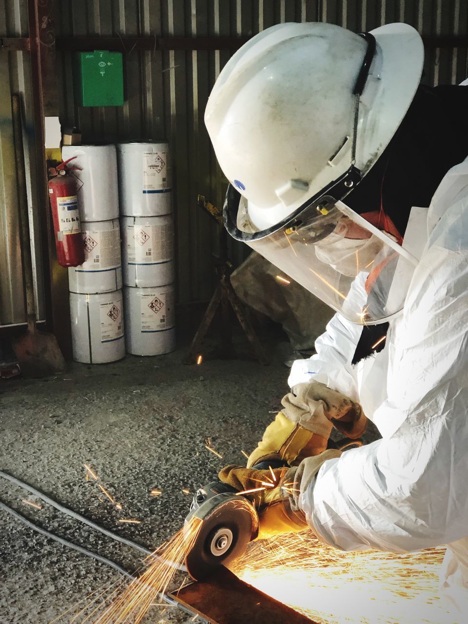 MAN WORKING ON METAL STRUCTURE