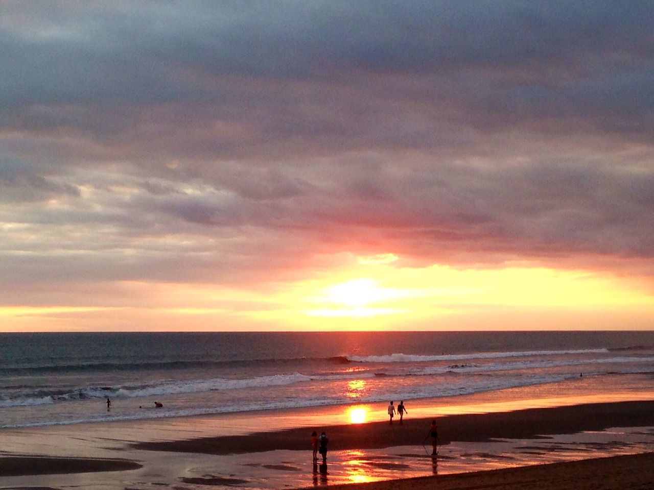 sea, horizon over water, beach, sunset, water, sky, shore, scenics, beauty in nature, tranquil scene, cloud - sky, tranquility, sand, orange color, idyllic, nature, vacations, wave, incidental people, cloud