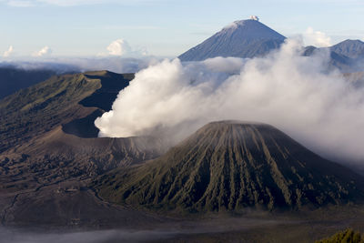 Panoramic view of volcanic landscape against cloudy sky