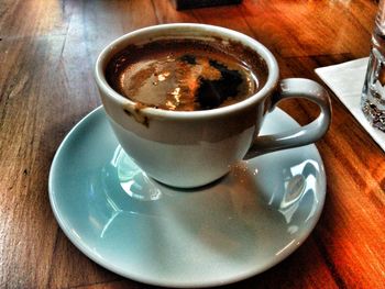 High angle view of cappuccino served on table