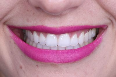 Extreme close up of woman with pink lips