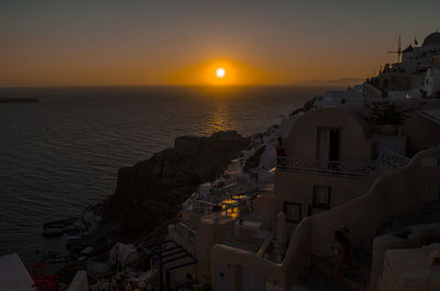 High angle view of town at sunset