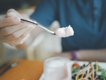 Close-up of hand holding ice cream