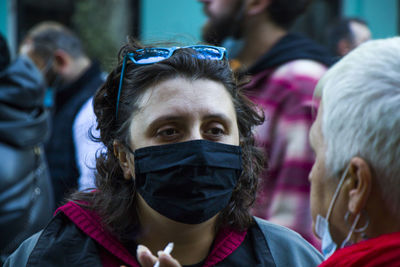 Close-up portrait of people against blurred background