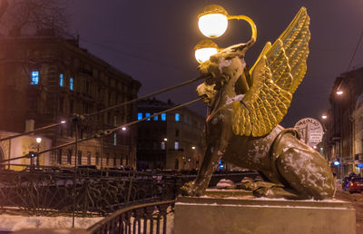 Low angle view of illuminated street light at night