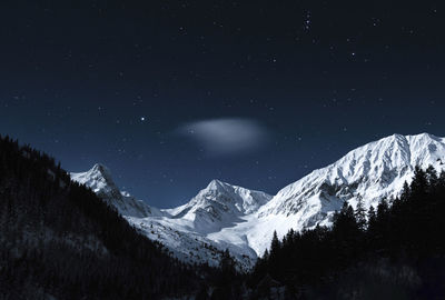 Mountain landscape during winter at midnight