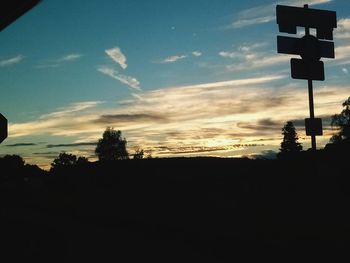 Low angle view of silhouette trees against sky during sunset