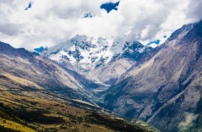 Scenic view of snowcapped mountains against sky