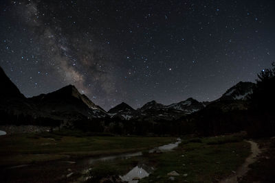 Scenic view of mountains against sky at night