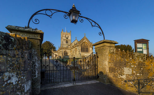 Low angle view of old building against blue sky