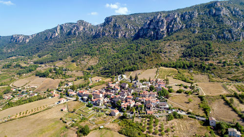 High angle view of houses and mountains against sky