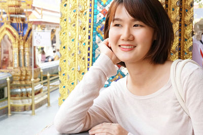 Portrait of smiling young woman