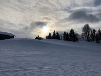 Scenic view of snow covered landscape against sky
