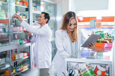 Portrait of young woman working at laboratory