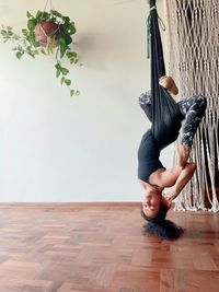 Low section of woman jumping on floor