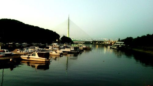 Boats moored at harbor